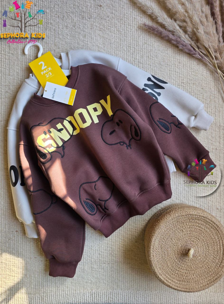 Brown children's sweatshirt with 'Snoopy' design on a textured surface