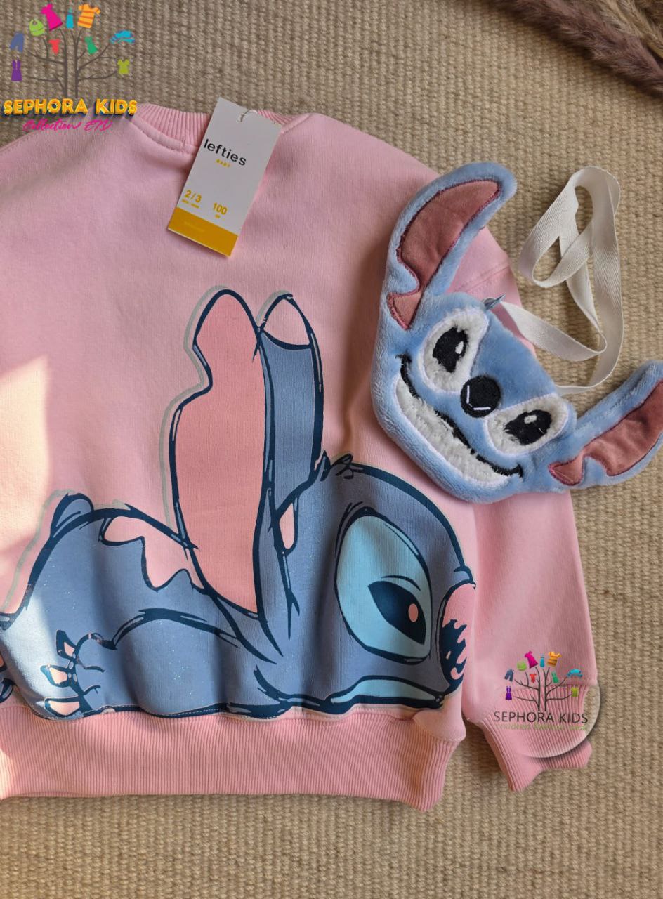 Children's pink sweater with cartoon character design on a textured surface, featuring Sephora Kids branding.